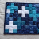 This one is from Andree and the blues and piecing are wonderful.  Love the "modern" look of it.