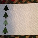 a placemat that will be used to set the table for our Capitol Area Modern Quilt Guild, Harrisburg, PA Christmas Party. At the end of the evening each person will go home with a placemat.