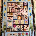 I finally finished one of the two "small" quilts A-Z for Ewe & Me<br />I love Janet Stone's designs and decided to do one for my sister (who also Loves sheep). I reduced them 50%. While not perfect, I throughly enjoyed making and quilting this beautiful quilt. My sister's is finished and a pic is what I am posting. My "top" will wait a bit longer to be quilted.  I love this project!