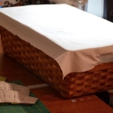 I could not find a picture frame the right size to tack my fabric to.  However, the top of the basket I use to store patterns was just the right size.  I stapled the fabric to the top of the basket and applied the gutta.  I sure hope it went all the way through the fabric.  Will see how this works!   <br />Suggestion: Find your picture frame FIRST! and then size your drawing to fit it!