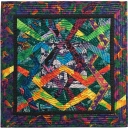 "St. Elmo's Fire" by RickyTims. These are three inch blocks. The one single block is reversed back and forth through the quilt.