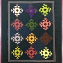 "Crown Of Thorns" by Cindy Neville, St. Louis, MO. Cindy has created a very traditional quilt in miniature. These blocks are only 3". This is an example of a traditional quilt represented in miniature.