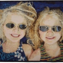 Sunny Girls - Sunny Girls, mosaic picture pieced, photo of my grand nieces Hannah and Claire. Aren\'t they cute? They were 4 1/2 at the time and just bursting with fun. I made this when my Mosaic Picture Quilting idea was new. This piece has 23,100 pieces that are1/2". This quilt has been in many national shows and got a 3rd place in Houston. It\'s been in several magazines as well. I am so happy that people love the quilt (I sure do).