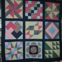 My Third Quilt - I made the blocks 20 or 25 years ago, put them together this past year and practiced lots of freehand machine quilting. It\'s a mess and I love it.