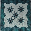 Blue Stars - Traditional feather star blocks set in original setting. Machine quilted on a APQS George.