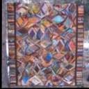 Serengeti Serendipity - I made this string quilt for my nephew, John, many years ago. The colors are a lot brighter than they appear in the picture. It remains one of my favorite quilts!