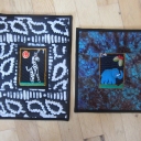 Little quilts donated to the Alzheimer's Art Quilt Initiative. The center embroideries were purchased from Tambani, an organization that provides an opportunity for South African women to provide for their families by making embroideries.