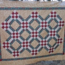 A Christmas quilt I made for my sister, Linda, sometime around 2005. I forgot to get a picture of it after I quilted it.