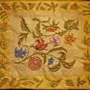 Autumnal Fantasy - Central panel started in a Jane Rollason painting on silk workshop. I added the border, free drew leaves and then quilted everything. Leaves overpainted. Trapunto added.