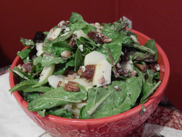 Salad with dates, apples, bacon, pecans, blue cheese on greens with poppyseed dressing