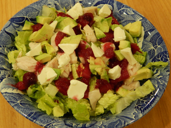 Salad with turkey, cranberry, lite cheese, and avocado