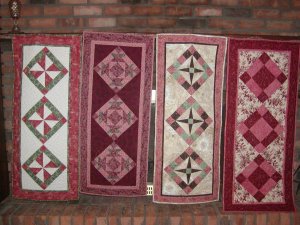 Rose colored wedding table runners