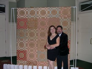 Miranda's Wedding quilt with Mom & Dad posing!