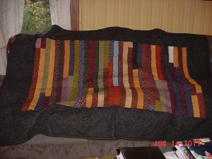 Jelly Roll quilt for homeless black border